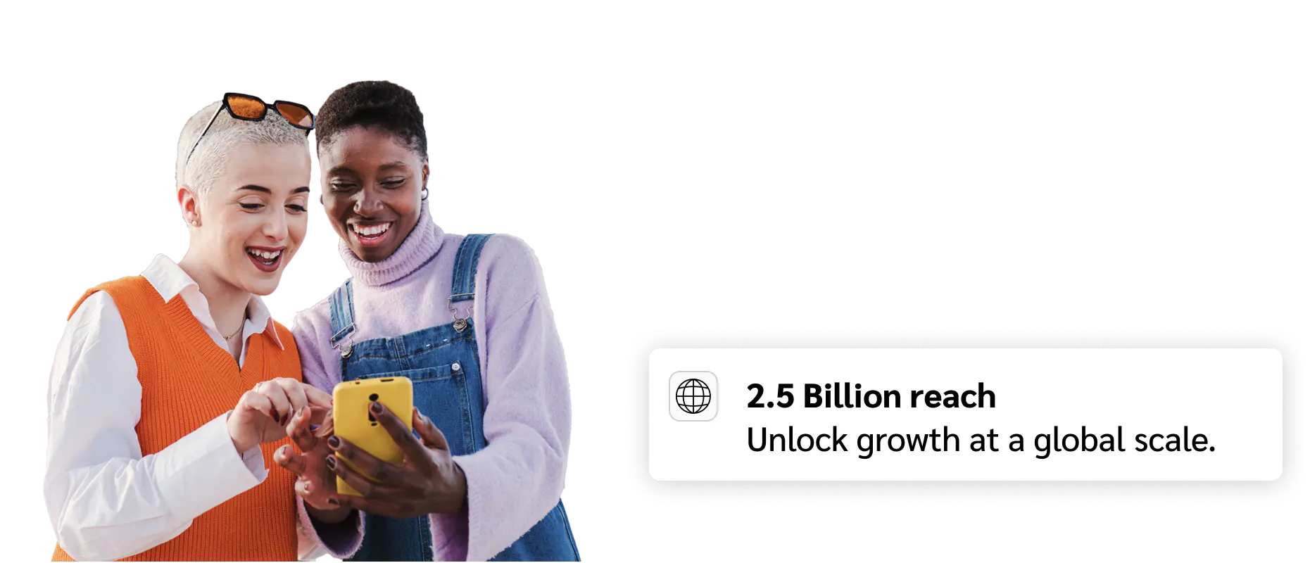 Two female looking at phone smiling next to stat